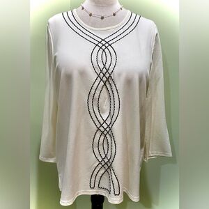 Elegant Cream Top with Black Curvy Graceful Detailing